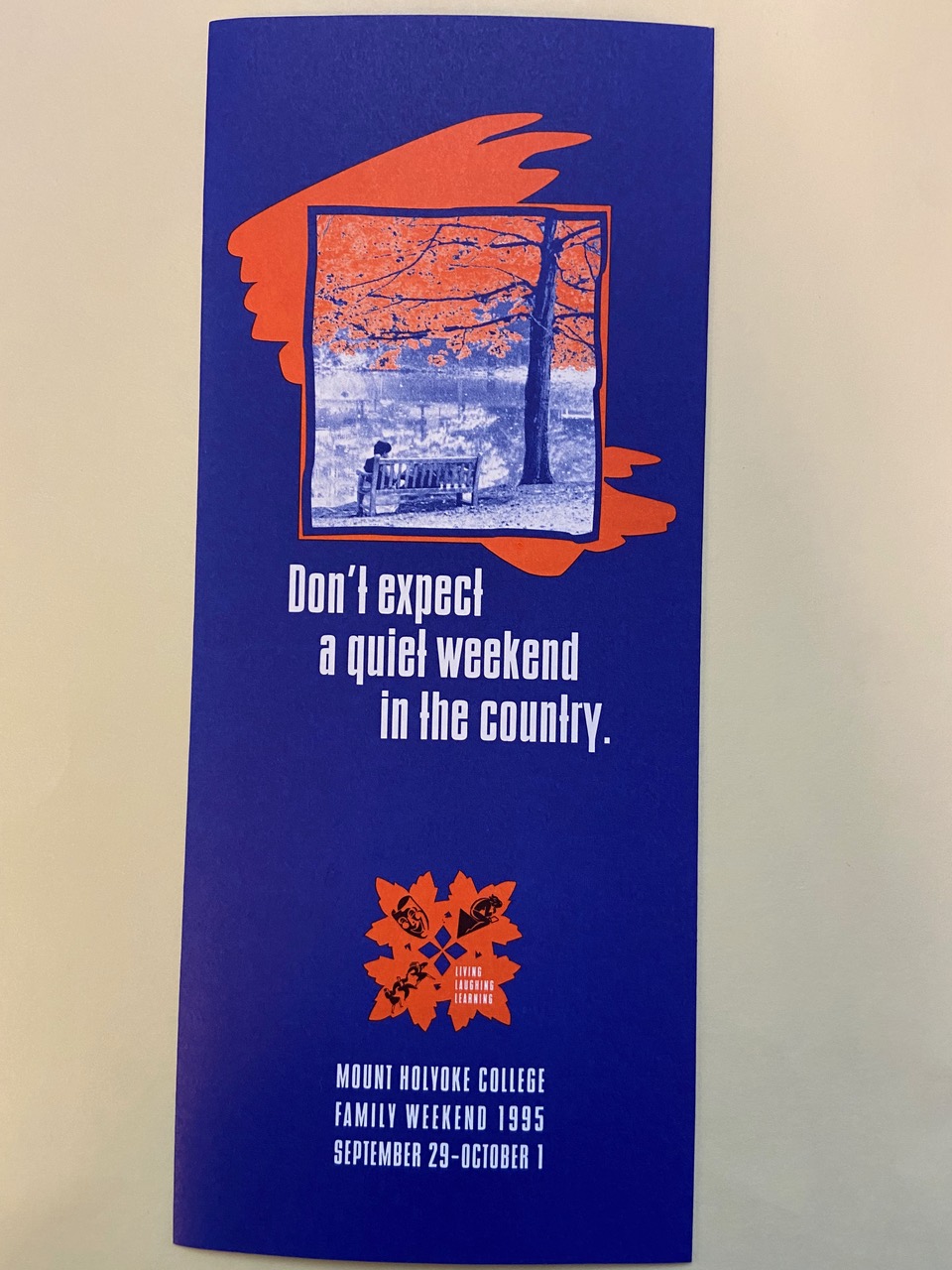 image of blue pamphlet with orange trees, describing friends and family weekend in 1995