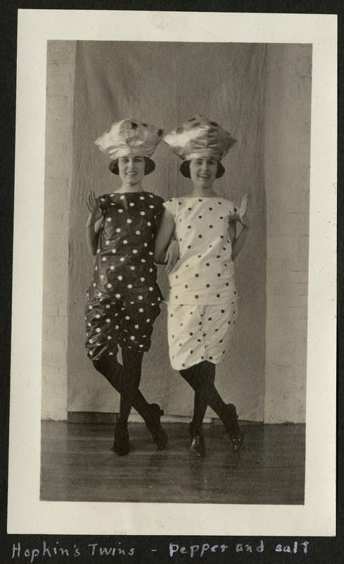 Two young women stand together in coordinating Salt and Pepper costumes