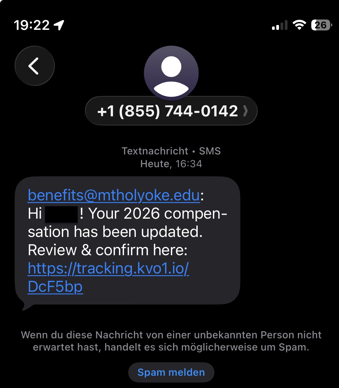 Text message on a black background reads: "benefits@mtholyoke.edu: Hi [name] ! Your 2026 compensation has been updated. Review and confirm here: [link]"